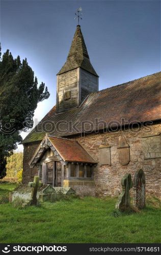 All Saints Church with its small wooden bell tower, Hanley William, Worcestershire, England.