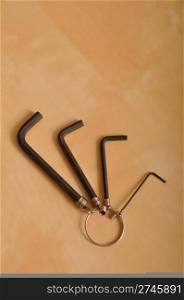 allen wrench set on a brown wooden background
