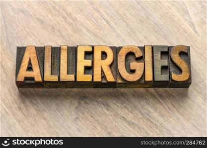 allergies - word abstract in vintage wood letterpress printing blocks