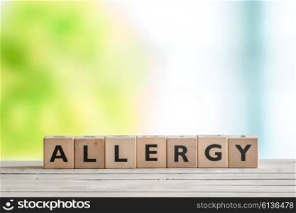 Allergy message sign on a wooden table