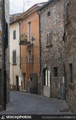 Alley by houses in town, Radda in Chianti, Tuscany, Italy