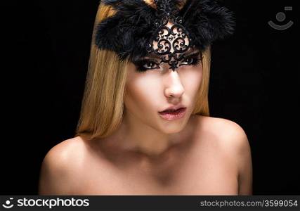 Allure. Fascinating Fancy Woman in Black Carnival Mask with Feathers. View