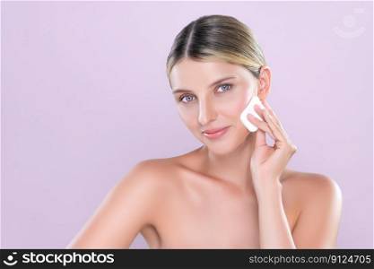 Alluring beautiful female model applying powder puff for facial makeup concept. Portrait of flawless perfect cosmetic skin woman put powder foundation on her face in pink isolated background.. Alluring beautiful female model applying powder puff for facial makeup concept.