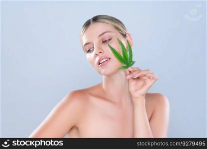 Alluring beautiful woman model portrait holding green leaf as concept for cannabis skincare cosmetic product for skin freshness treatment in isolated background.. Alluring beautiful woman portrait hold green leaf as cannabis skincare concept.