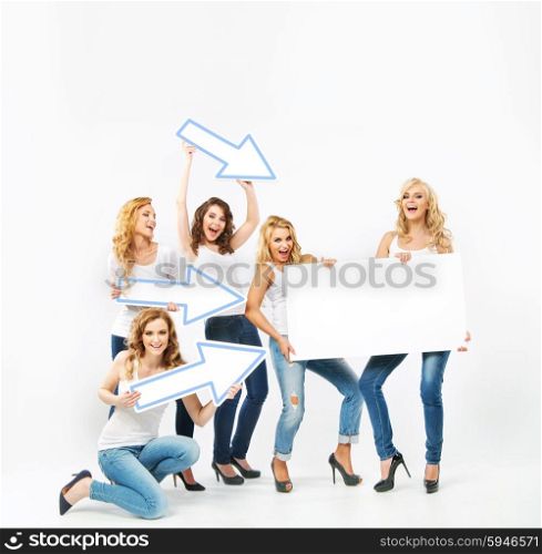 Alluring women pointing the empty board