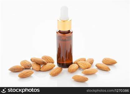 Almond essential oil isolated on white background. Almond oil for Cosmetic or beauty care