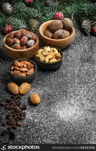 Almond,hazelnut and walnut on the background of Christmas tree
