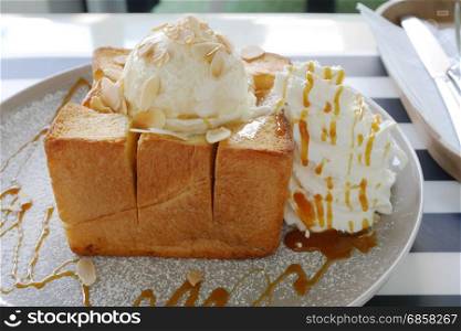 Almond honey toast with vanilla ice cream.