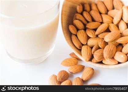 Almond milk and grain on white kitchen table, stock photo