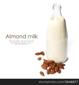 Almond milk in a glass bottle on white background