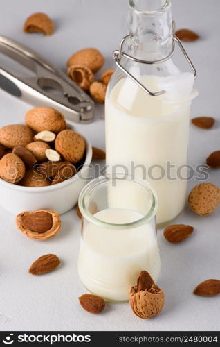 Almond milk with natural organic almonds and nutcracker