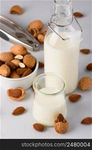 Almond milk with natural organic almonds and nutcracker