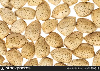 almond nuts in shells against white background