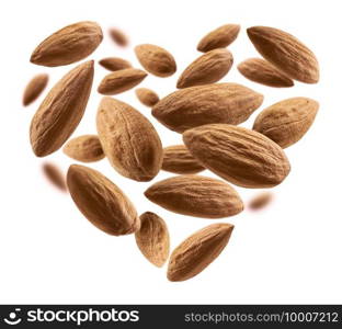 Almond nuts in the shape of a heart on a white background.. Almond nuts in the shape of a heart on a white background