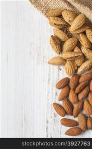 almond nuts on wood background