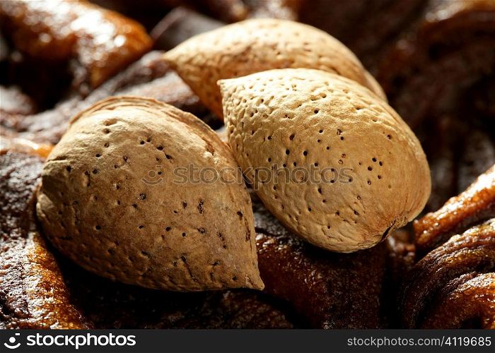 Almond nuts over chocolate, delicious golden food