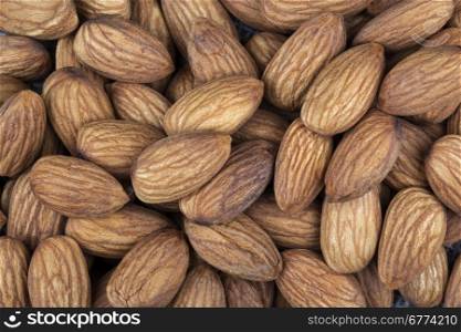 Almonds are the oval seed (kernel) of the almond tree. The fruit of the almond is a drupe, consisting of an outer hull and a hard shell with the seed (which is not a true nut) inside.