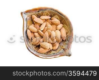 Almonds. bowl full of almond nut on white with shadow. Almonds in a bowl