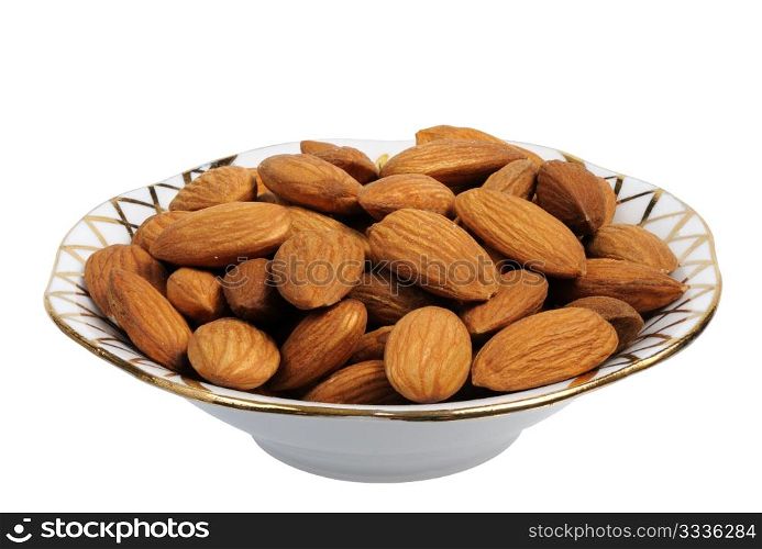 Almonds in a plate on white background, isolated