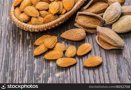 almonds nuts on a wooden table background