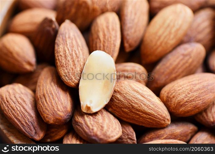 Almonds on background top view on the table, Close up roasted almond nuts natural protein food and for snack