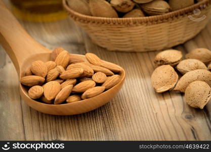 Almonds on brown wooden background. Beneficials for the brain