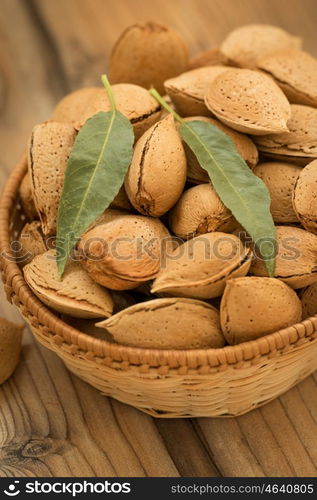 Almonds on brown wooden background. Beneficials for the brain