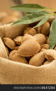 Almonds on brown wooden background. Beneficials for the brain