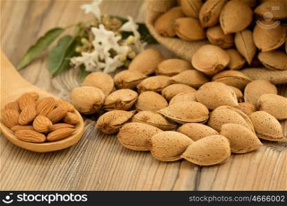 Almonds on brown wooden background. Beneficials for the brain