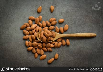 Almonds on dark background top view on the table, Close up roasted almond nuts natural protein food and for snack