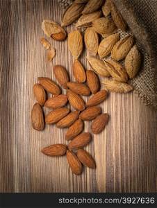 Almonds on rustic wooden background