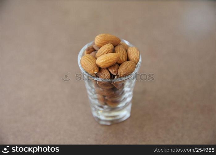 Almonds on wood background