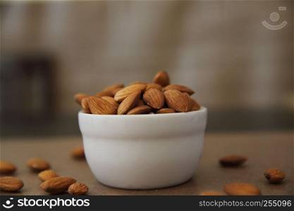 Almonds on wood background