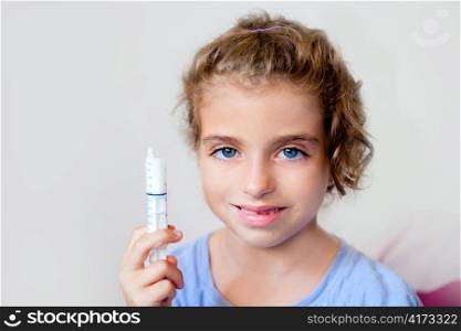 almost happy children kid girl with syringe of antibiotic medicine