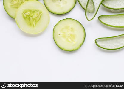 Aloe vera and cucumbers isolated on white background