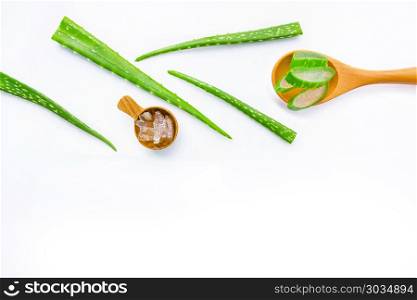 Aloe vera fresh leaves with aloe vera gel on wooden spoon. . Aloe vera fresh leaves with aloe vera gel on wooden spoon. isolated on white