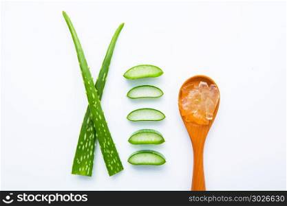 Aloe vera fresh leaves with aloe vera gel on wooden spoon. isolate