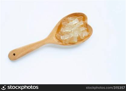 Aloe vera gel on wooden spoon on white background. Aloe vera is a popular medicinal plant for health and beauty,