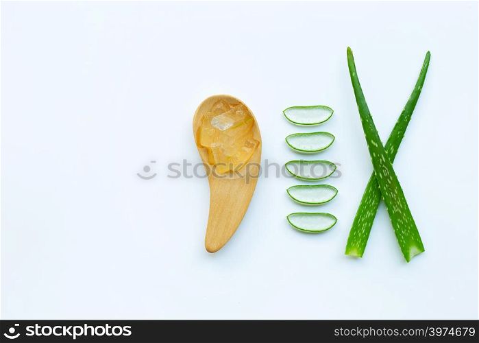 Aloe vera gel with slices and aloe vera leaves on white background.