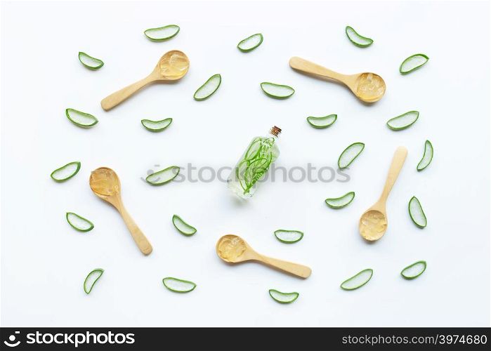 Aloe vera gel with slices and extract on white background.