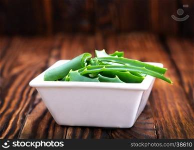 aloe vera in white bowl and on a table