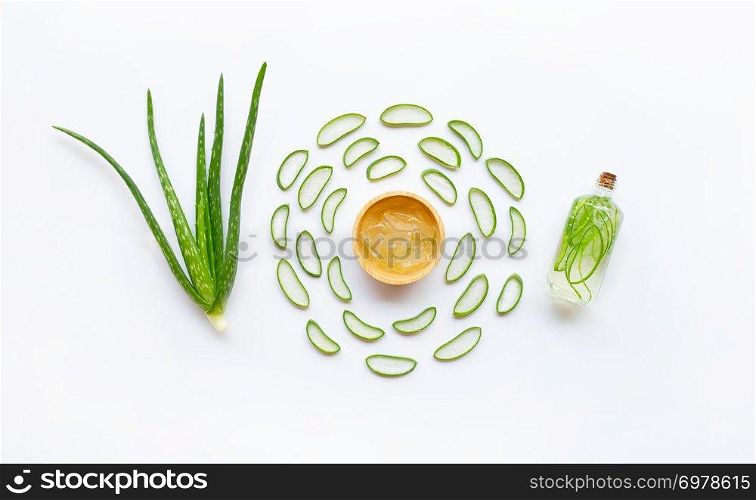 Aloe vera with slices and extract on white background.