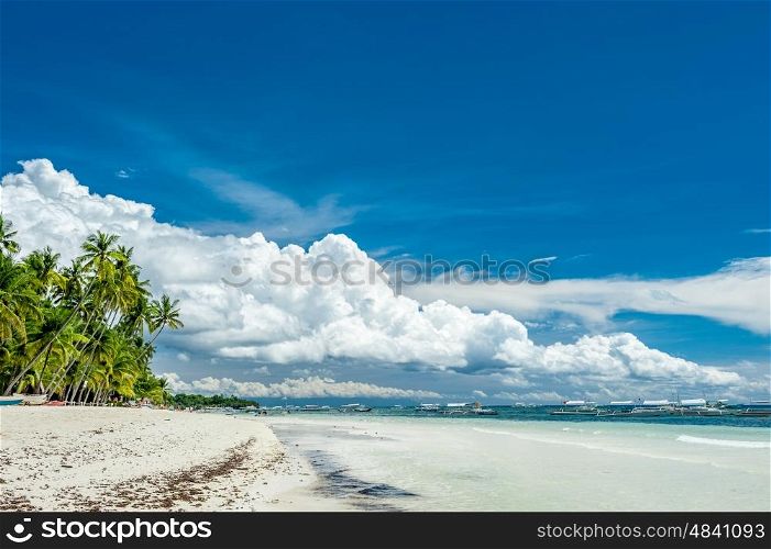 Alona tropical beach with palm trees at Panglao, Philippines