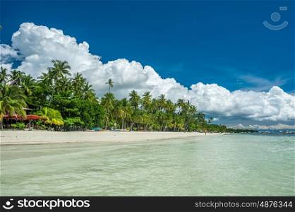 Alona tropical beach with palm trees at Panglao, Philippines