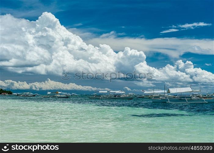 Alona tropical beach with traditional boats at Panglao, Philippines