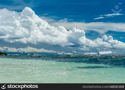 Alona tropical beach with traditional boats at Panglao, Philippines