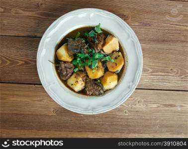 Aloo gosht - meat curry in North Indian and Pakistani cuisine.consists potatoes aloo cooked with meat gosht