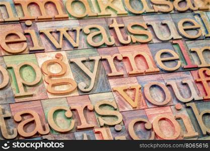 alphabet abstract background - random letters in letterpress wood type printing blocks