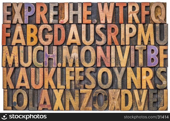 alphabet abstract in antique letterpress wood type printing blocks stained by color inks, isolated on white