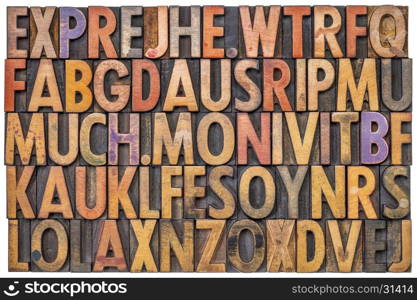 alphabet abstract in antique letterpress wood type printing blocks stained by color inks, isolated on white